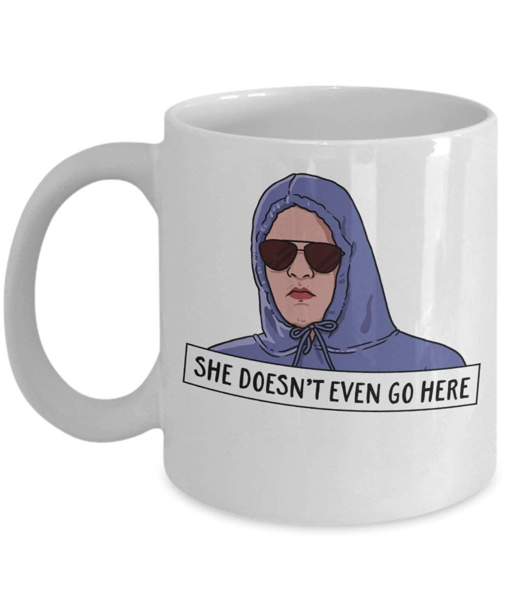 She Doesn't Even Go Here Coffee Mug Cup (White) 11oz Funny Mean Girls Movie Gift Merchandise Accessories Shirt Poster Sticker Pin Decal Artwork Novelty